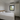 Bedroom with a bed, wardrobe, and window. Container home