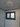 Ceiling light fixture with a window in a room, featuring 'Home Technology Club' branding.