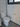 White toilet in a bathroom with tiled walls and a mirror.